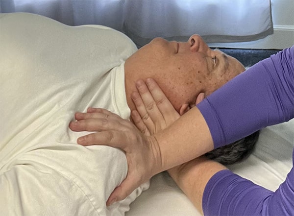 Therapist performing myofascial release to relieve pain and improve mobility in Baton Rouge, LA